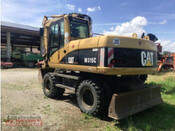 Bager na kotačima Caterpillar m 315c: slika Bager na kotačima Caterpillar m 315c