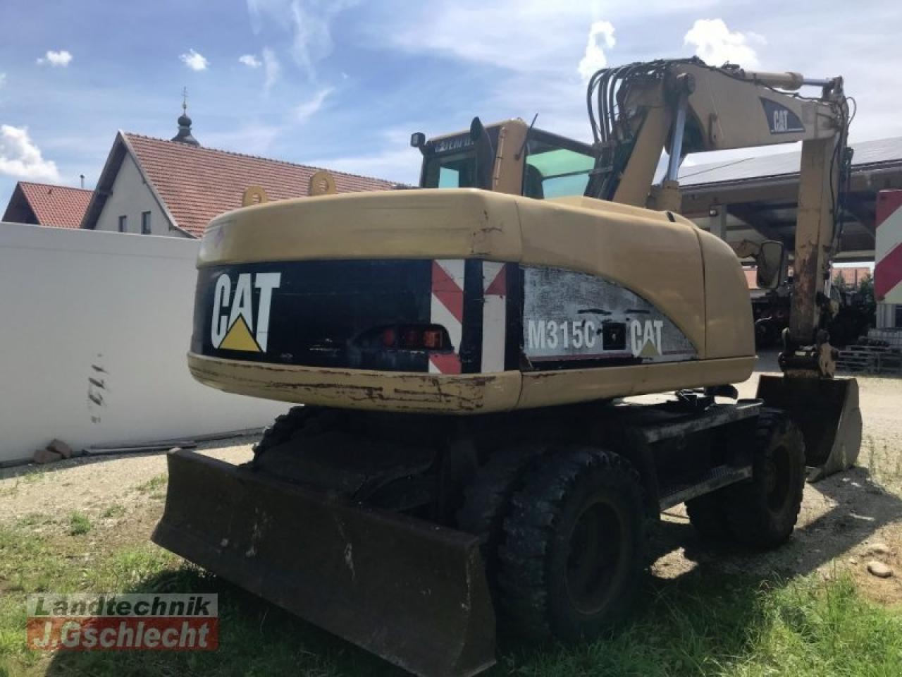 Bager na kotačima Caterpillar m 315c: slika Bager na kotačima Caterpillar m 315c