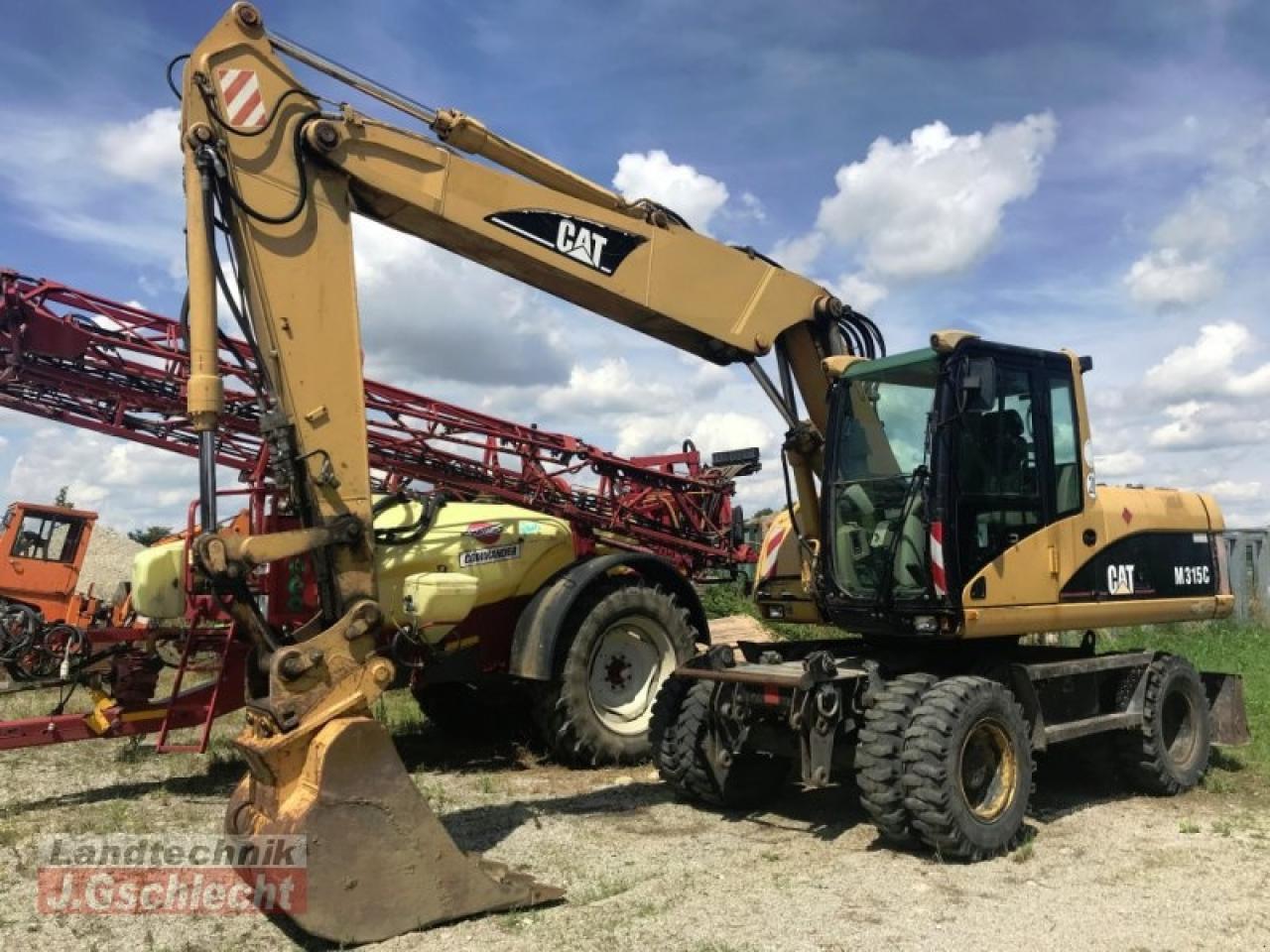 Bager na kotačima Caterpillar m 315c: slika Bager na kotačima Caterpillar m 315c